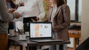 Home - Agency close up of laptop with business charts on desk 2025 02 20 07 24 59 utc scaled.jpg